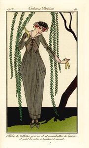 Woman in grey taffeta dress with linen collar and cuffs, satin gilet with enamel buttons, under a willow tree