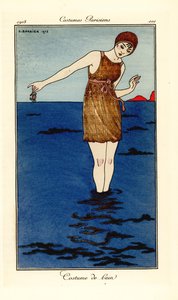 Woman in Swimming Costume Up to Her Ankles in the Sea Holding a Crab