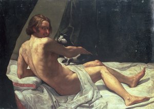 Young Man Lying on a Bed with a Cat