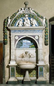 Decorated fountain with a high relief in marble and terracotta by Giovanni della Robbia. Sacristy of Santa Maria Novella, Florence