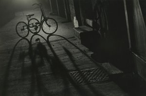 Silhouette of a Tricycle at Night by Godfrey Macdominic