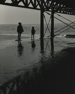 Two kids playing at the beach