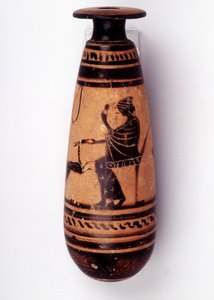 Painting on vase: alabaster used to contain the perfume: one face depicts a woman playing with a doe and holding a flower. Her basket to hold the wool is behind her. 500 BC. BNF, Medal Office by Greek