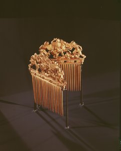 Combs ornamented with warriors in combat, five crouching lions below