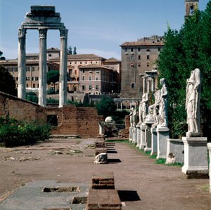 Roman Forum: statues of vestals. House of vestals (Casa delle Vestali or Atrium Vestae). On the left, the Greek temple of Dioscures (or temple of Castor and Pollux) (5th century BC). Rome