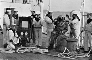 Diver and His Apparatus on Board HMS Blake, 1896