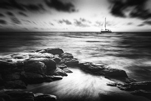 Sailboat Over Rocky Coast