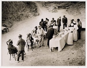 Distinguished visitors taking refreshments near the Tomb of Tutankhamun at the opening of the inner chamber, Valley of the Kings by Harry Burton