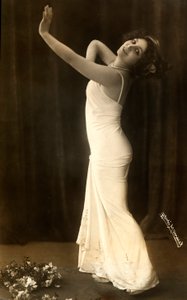 Portrait of the French Actress Regina Badet in an Evocative Pose, Wearing a Long White Dress