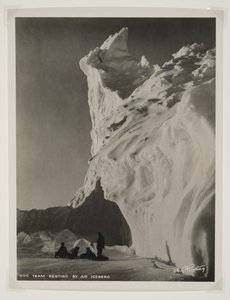 Dog Team Resting by an Iceberg