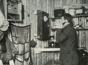 Dr. Simpson in the Hut at the Other End of the Telephone Timing the Observation by Herbert Ponting