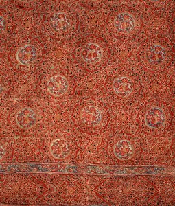 Fabric with a floral pattern and roundels within frames