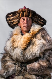 A portrait of a Kazakh eagle hunter in western Mongolia by Ira Block