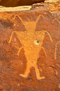 Near Vernal, UT at McKee Springs, Fremont petroglyphs showing warriors holding trophy heads