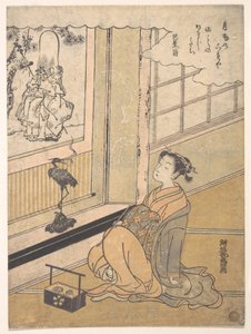 A Young Woman Seated in a Room and Looking at a Kakemono of Fukurokujin by Isoda Koryusai