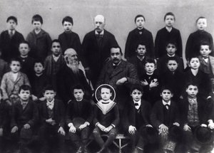 Benito Mussolini in elementary school - A portrait of Benito Mussolini with classmates and some teacher by Italian Photographer