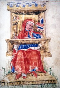 A Jewish man writing in a chair