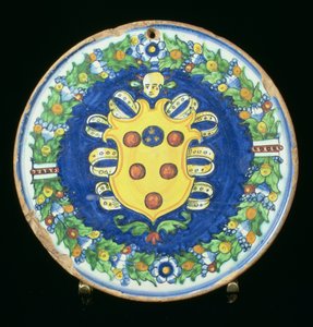 Maiolica plate bearing the Medici coat of arms with a border of foliage and fruit, Italian, 16th century by Italian School
