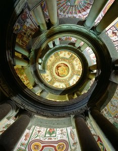 View of the stone spiral staircase looking up towards the ceiling, designed by Jacopo Vignola and his successors
