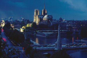 Exterior view of Notre Dame at night. Paris, France