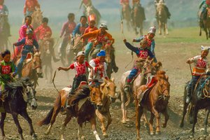 Youngsters in a horse race at a summer festival held near Ulaanbaatar