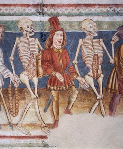 Hrastovlje Fortified Church, Trinity Church, Death Accompanying Merchant and Wealthy Banker, Dance of Death (detail)