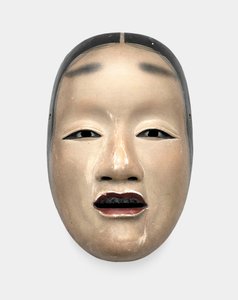 A wood mask with gofun ground, painted with sumi for the hair, eyes and teeth and red for the lips by Japanese School