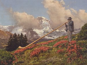 Switzerland: An Alphorn Blower, the Jungfrau in the background by Jean Gaberell