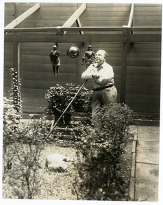 Tony Sarg in his garden by Jessie Tarbox Beals