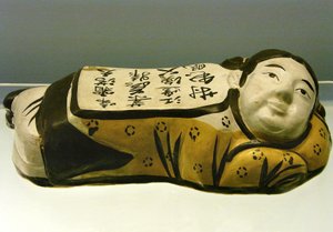 Ceramic, child-shaped pillow, with a poem evoking a night landscape (Photography by Leonard de Selva) by Jin Dynasty Chinese School