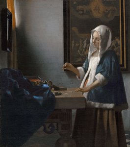 Woman Holding a Balance by Johannes Vermeer