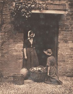 Two Women, One Kneeling and One Standing, Looking into Basket Filled with Vegetables