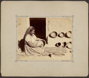 Woman Polishing Pottery by John K. Hillers