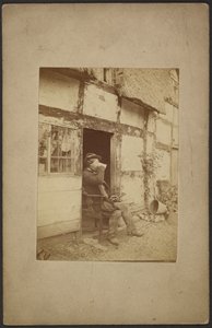 Seated man drinking from mug in open doorway by John Whistler