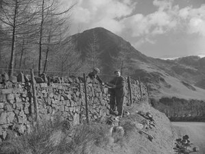 Two Wallers Working on Wall