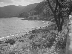 View of lakeshore and hills in background