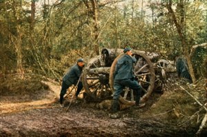 Three French soldiers in the woods with a Howitzer, Verdun, September 1916