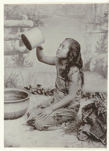 Studio portrait of a young Javanese washing woman by Kassian Cephas