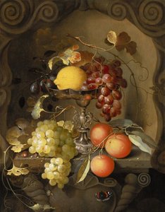 Still life of fruit on and around a tazza, in a niche