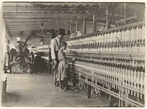Man with Girl at Spinning Machine, South Carolina Cotton Mill
