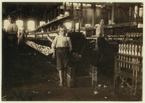 8 Year Old Leo, Only 4 Feet Tall, Picks Up Bobbins for 15 Cents a Day at Elk Cotton Mills, Fayetteville, Tennessee, 1910 by Lewis Wickes Hine