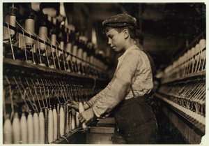 A Doffer Replaces Full Bobbins at Globe Cotton Mill, Augusta, Georgia