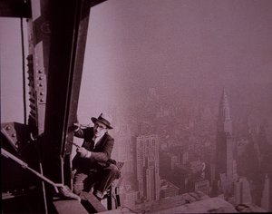 Empire State Building under construction, showing an inspector checking work by Lewis Wickes Hine
