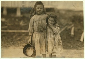 Maud and Grade Daly, 5 and 3 years old pick about a pot of shrimp each day for the Peerless Oyster Company, Bay St. Louis, Mississippi, 1911 by Lewis Wickes Hine