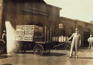 Men in Front of a Wells Fargo and Co Express Depot with Crates and Milk Cans, Springfield, Missouri, 1916 by Lewis Wickes Hine