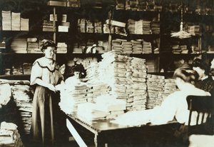 Young women sorting papers in a storeroom, c.1905