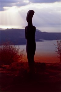 Cycladic Idol on the Background of the Coast at Sunset, Cyclades Islands, Greece, Cycladic Civilization