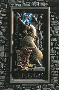 Unicorn, heraldic crest on the facade of Holyrood palace, Edinburgh, Scotland, United Kingdom