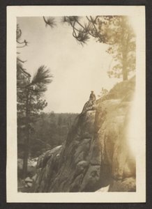 Figure on Rocky Cliff