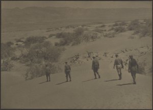Five Men Walking in Desert by Louis Fleckenstein